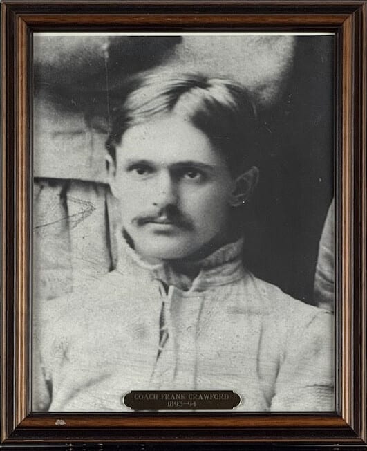Black-and-white portrait of Frank Crawford, moustached, in a heavy football sweater.