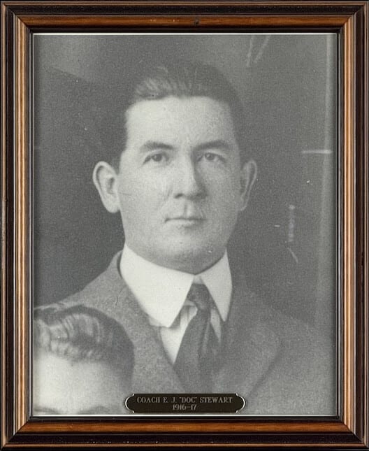 Black-and-white portrait of E.J. Stewart in a three-piece suit.