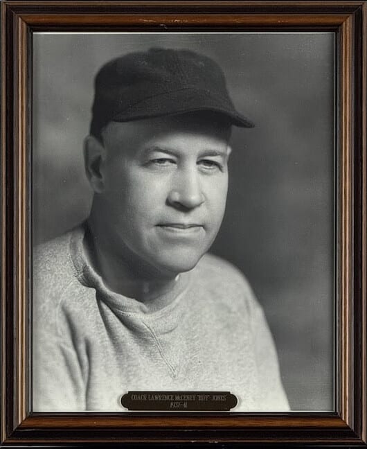 Black-and-white portrait of Biff Jones in a dark cap and sweatshirt.