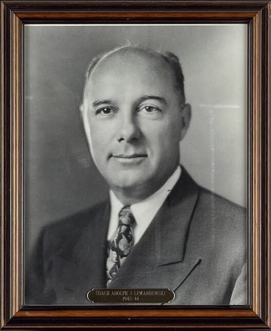 Black-and-white portrait of Adolph Lewandowski in a suit and patterned tie.