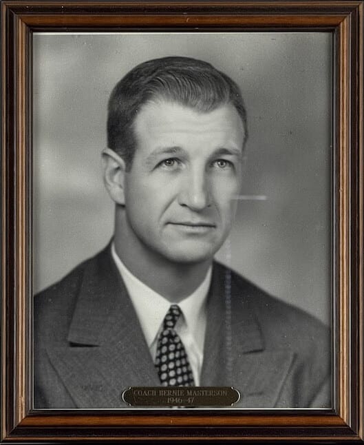Black-and-white portrait of Bernie Masterson in a suit and patterned tie.