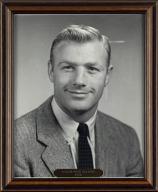 Black-and-white portrait of Pete Elliott in a tweed jacket.