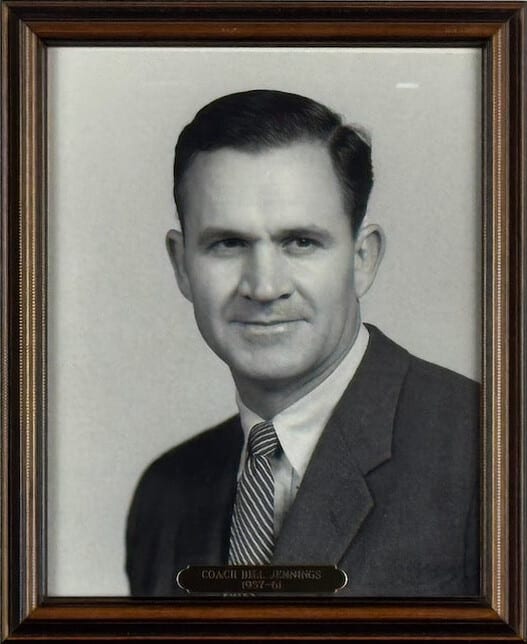 Black-and-white portrait of Bill Jennings in a dark suit and striped tie.
